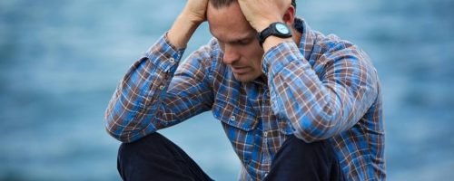 Man experiencing stress and emotional overload